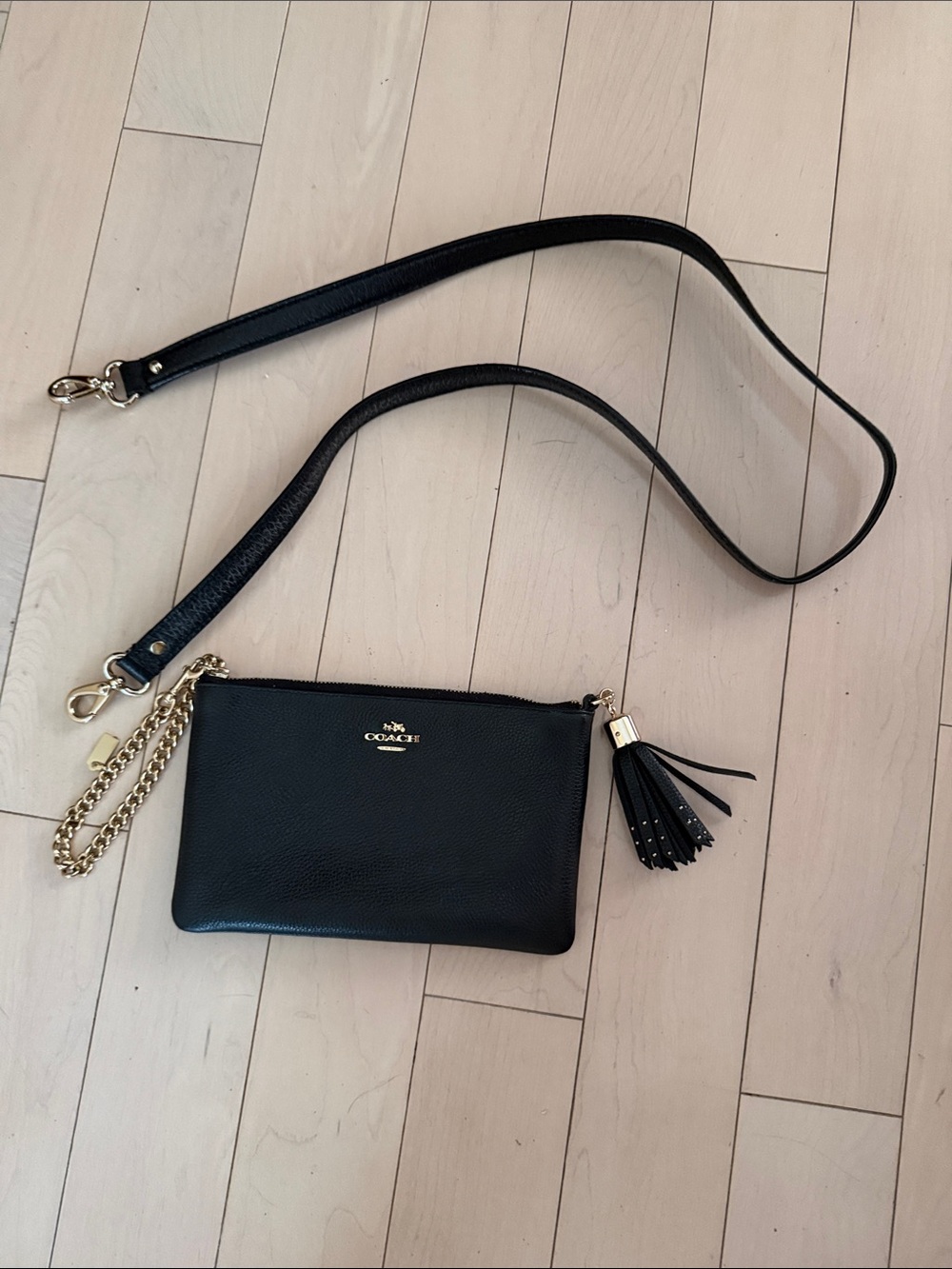 Coach Black Leather with Tassel and Chain, has a strap for crossbody